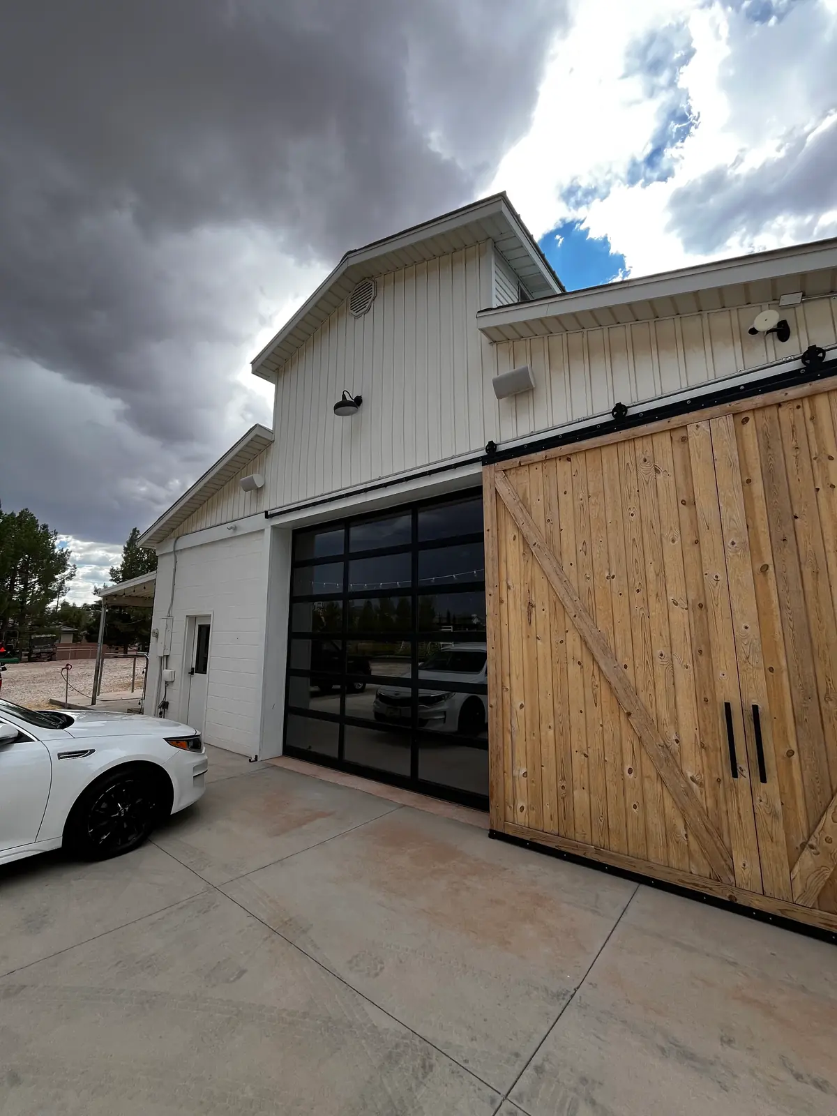 Completed custom barn-style garage-door installation by STG Garage Co.